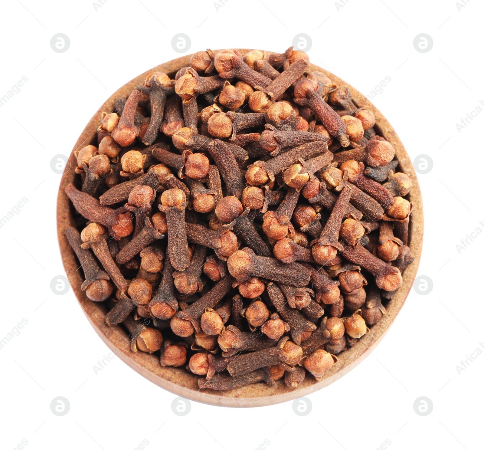 Photo of Aromatic dry cloves in wooden bowl isolated on white, top view