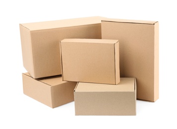 Photo of Pile of cardboard boxes on white background