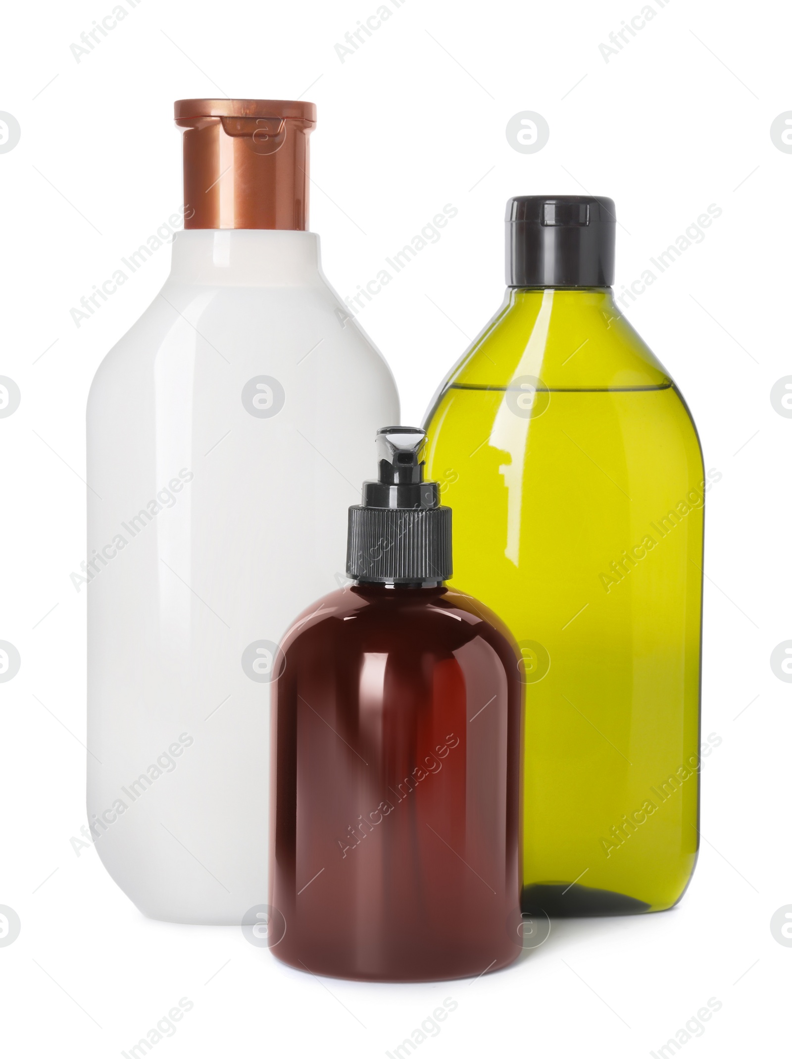 Photo of Different bottles of shampoo on white background