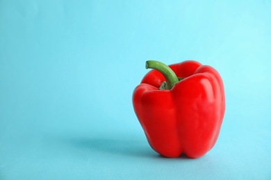 Photo of Raw ripe paprika pepper on color background