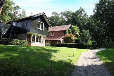 Picturesque view of beautiful house and plants on sunny day