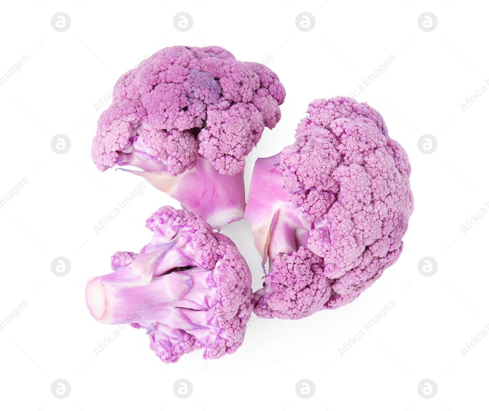 Photo of Cut purple cauliflowers on white background, top view. Healthy food