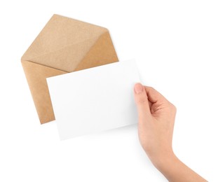 Photo of Woman holding blank letter on white background, top view