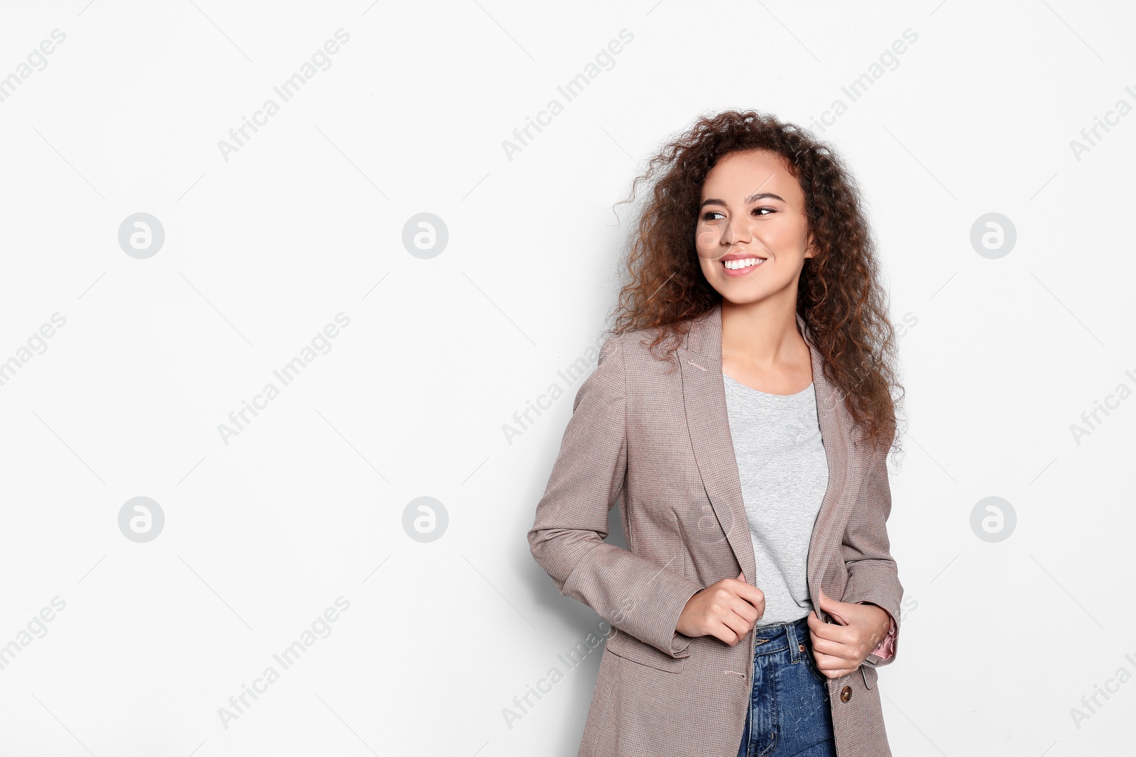 Photo of Young African-American woman with beautiful face on white background