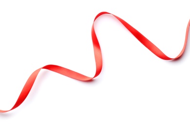 Photo of Simple red ribbon on white background, top view. Festive decoration