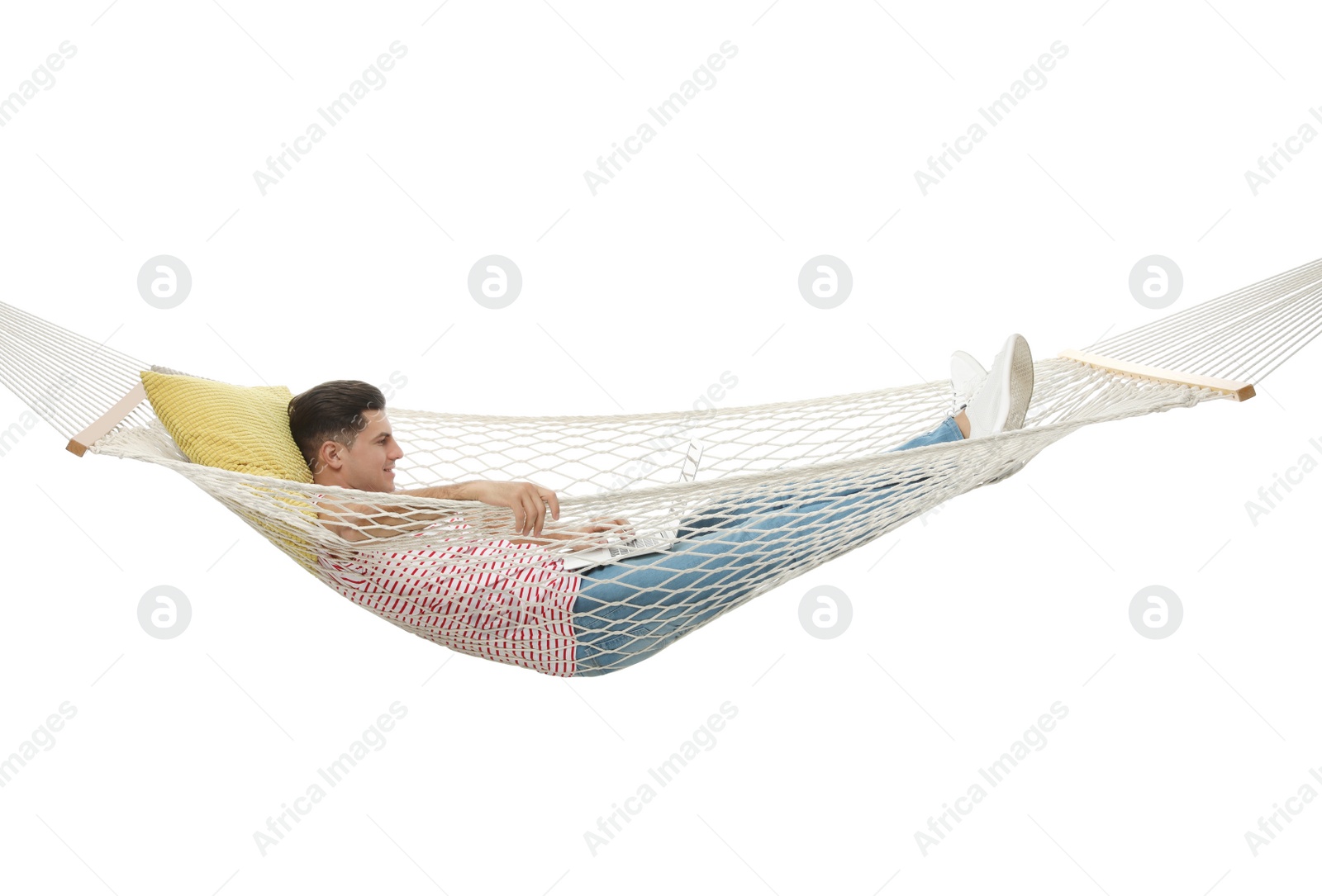 Photo of Man with laptop in hammock on white background