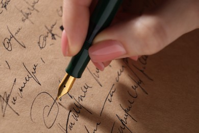 Woman writing letter with fountain pen, closeup