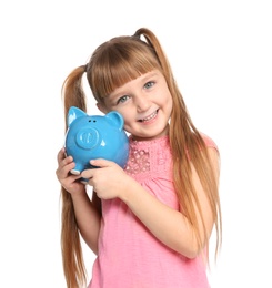 Photo of Portrait of little girl with piggy bank on white background