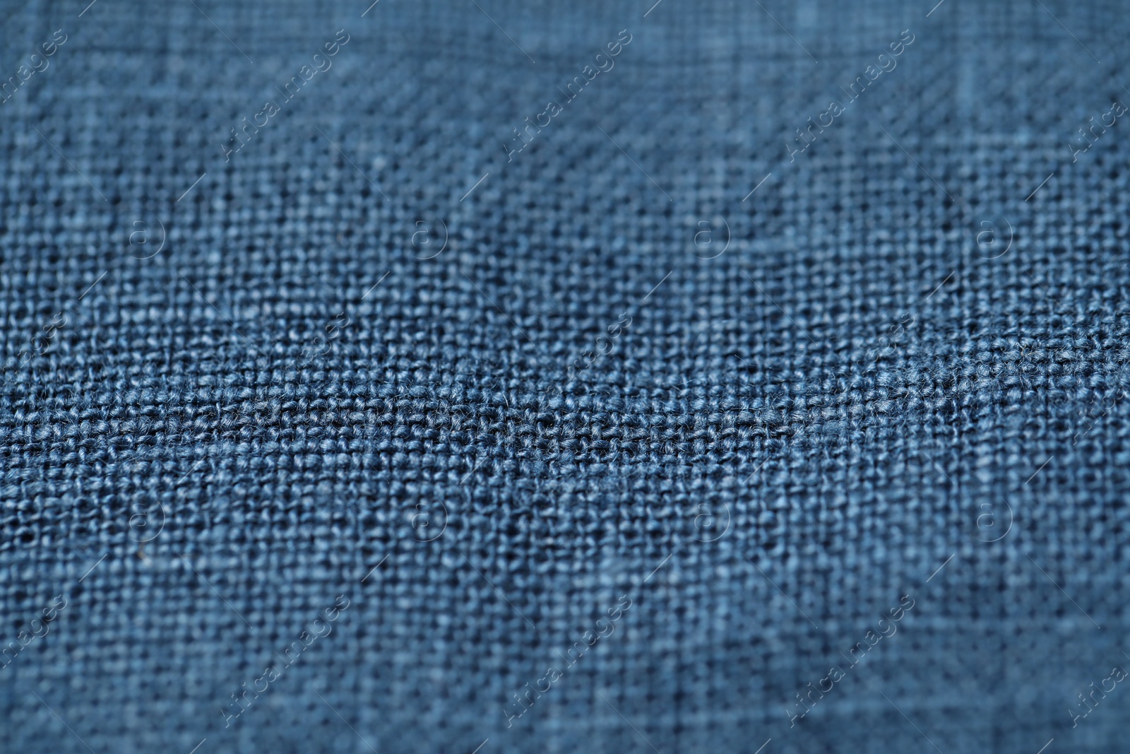 Photo of Texture of blue fabric as background, closeup