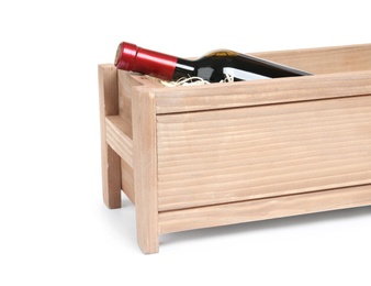 Photo of Open wooden crate with bottle of wine isolated on white