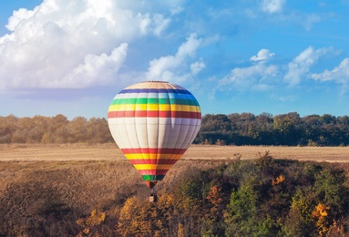 Photo of Beautiful view of hot air balloon flying over countryside