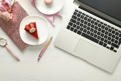 Photo of Flat lay composition with laptop on white wooden table. Fashion blogger