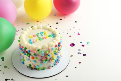 Photo of Cute bento cake with tasty cream and decor on white background