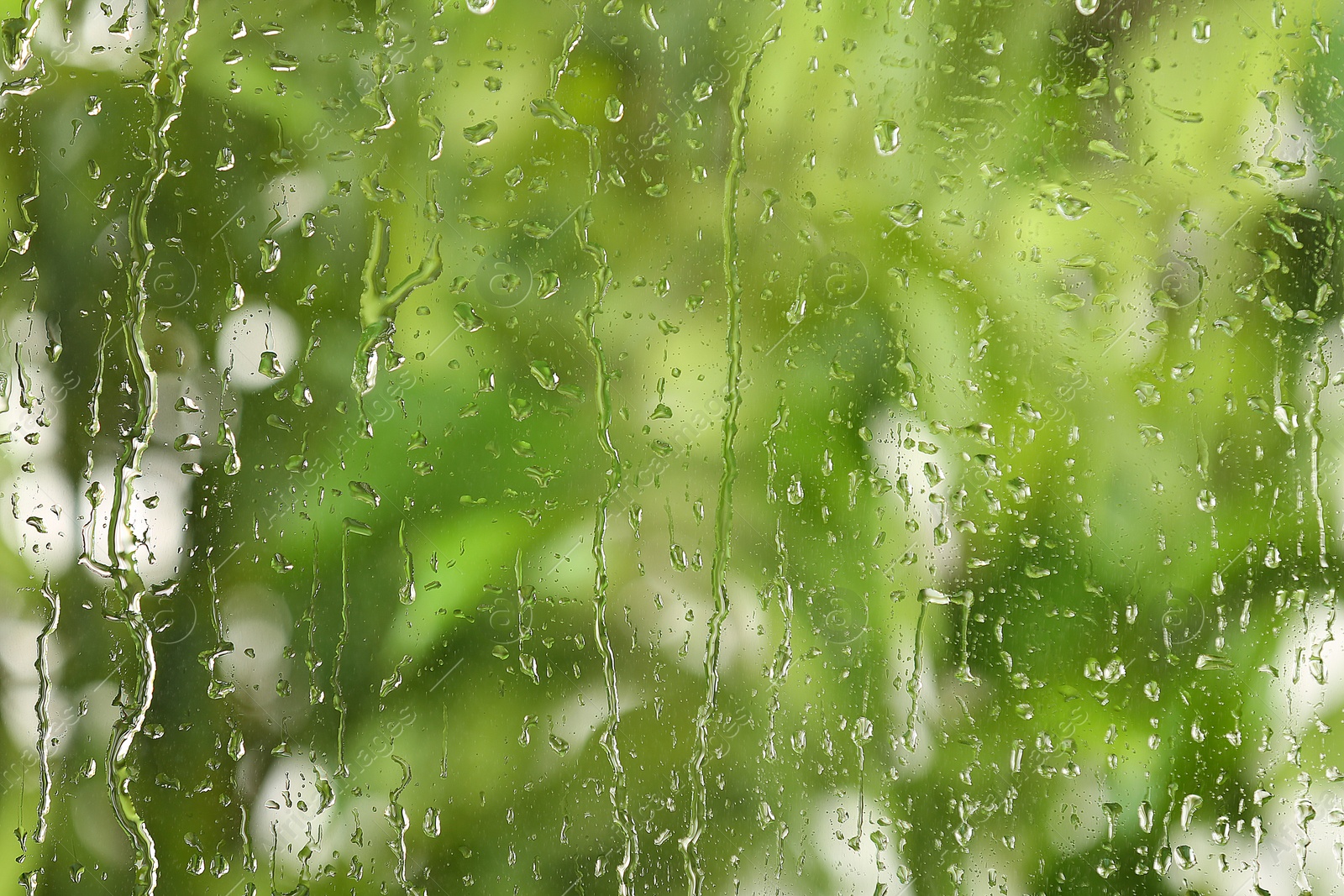 Photo of View of glass with water drops, closeup