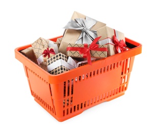 Photo of Orange shopping basket with different gifts on white background