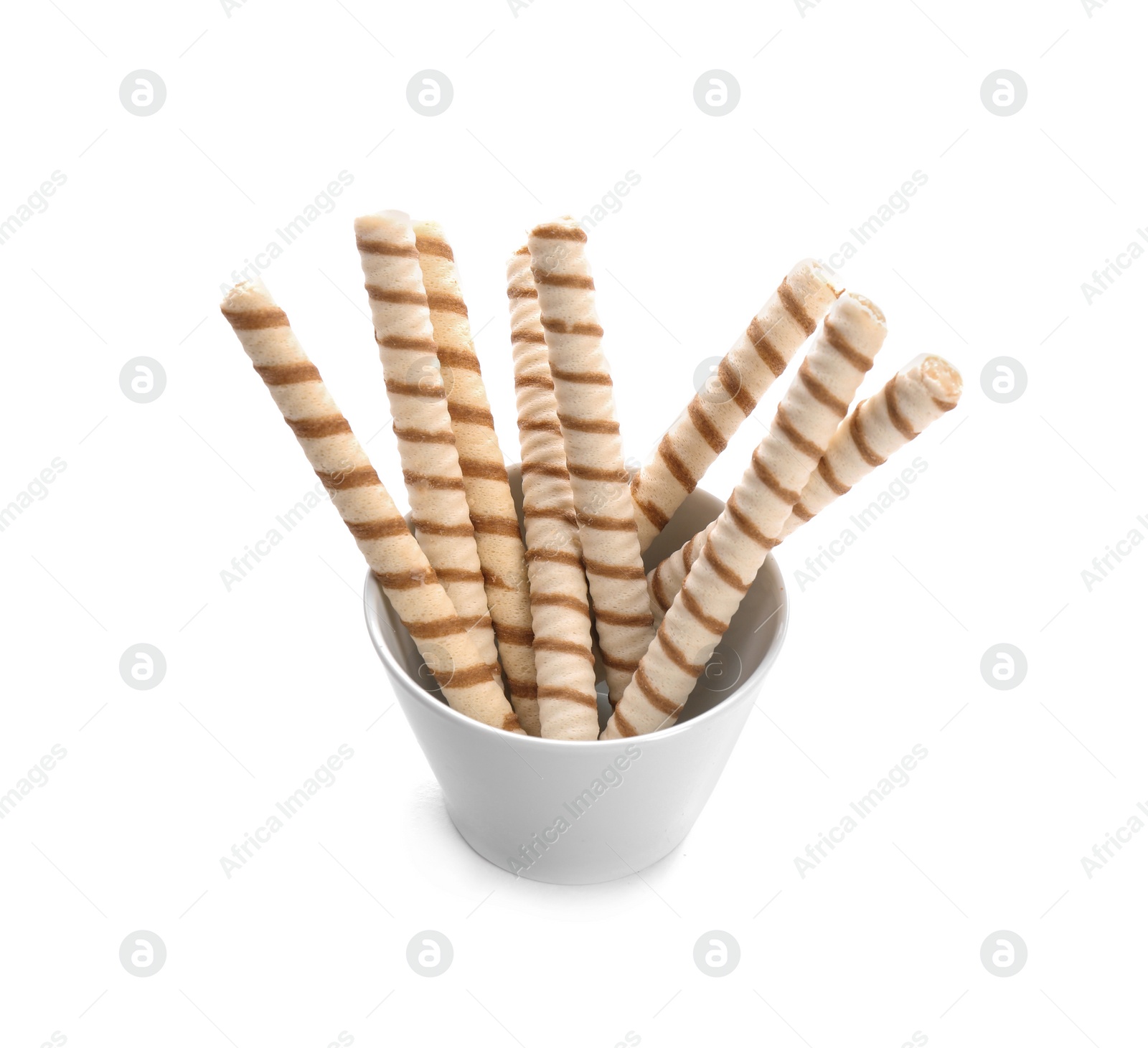 Photo of Bowl with tasty wafer roll sticks on white background. Crispy food