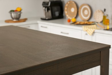 Photo of Stylish wooden table in kitchen. Interior design