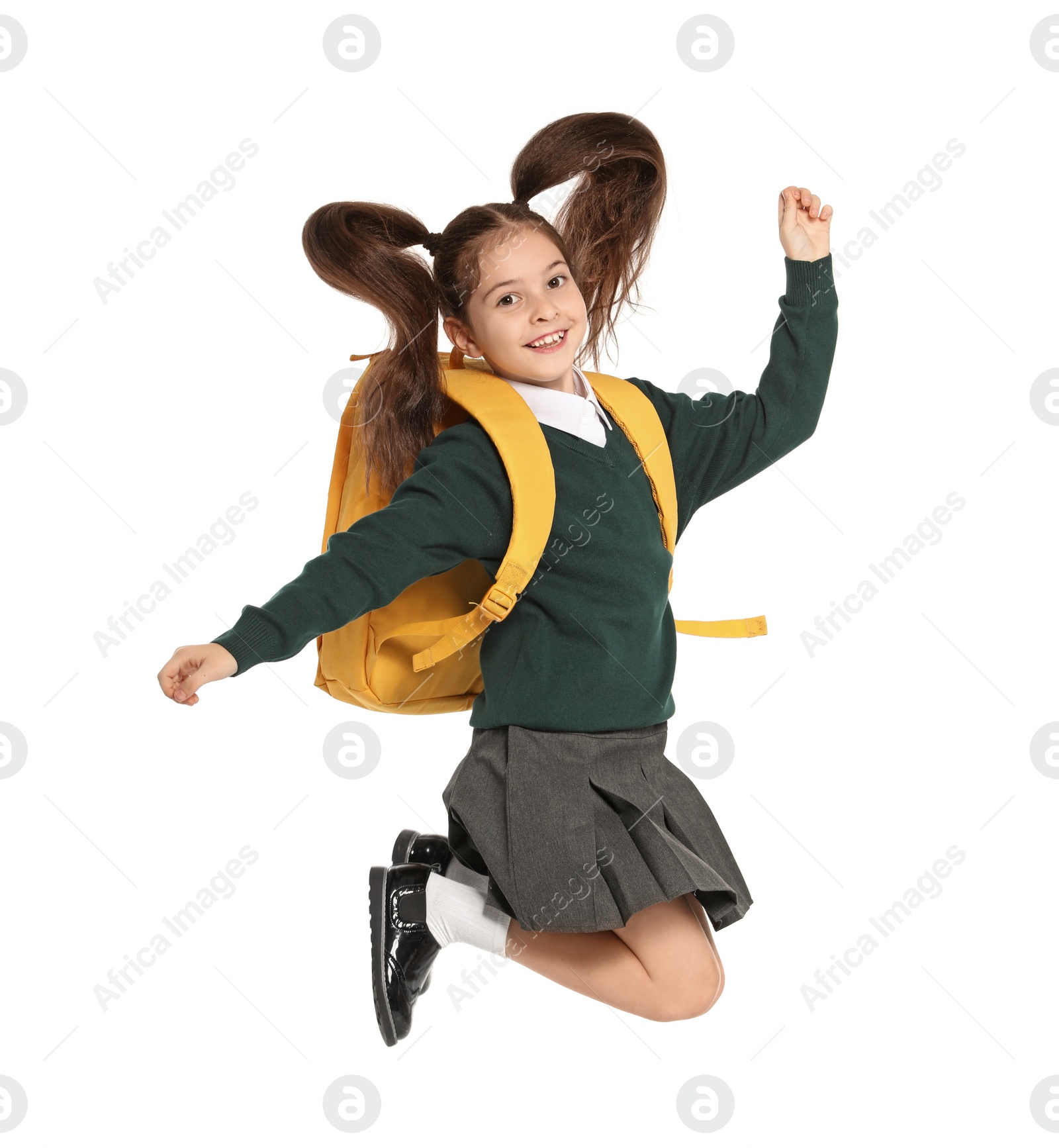 Photo of Little girl in stylish school uniform on white background