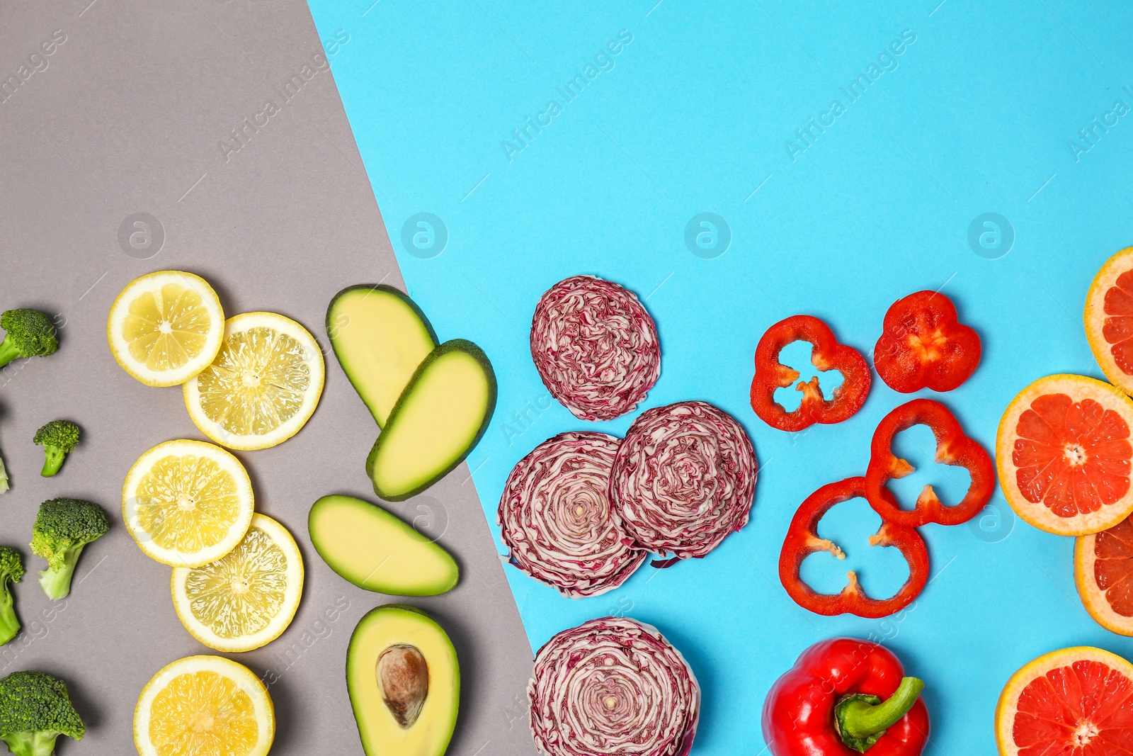 Photo of Rainbow composition with fresh vegetables and fruits on color background, flat lay