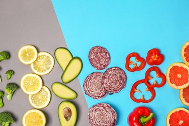 Photo of Rainbow composition with fresh vegetables and fruits on color background, flat lay