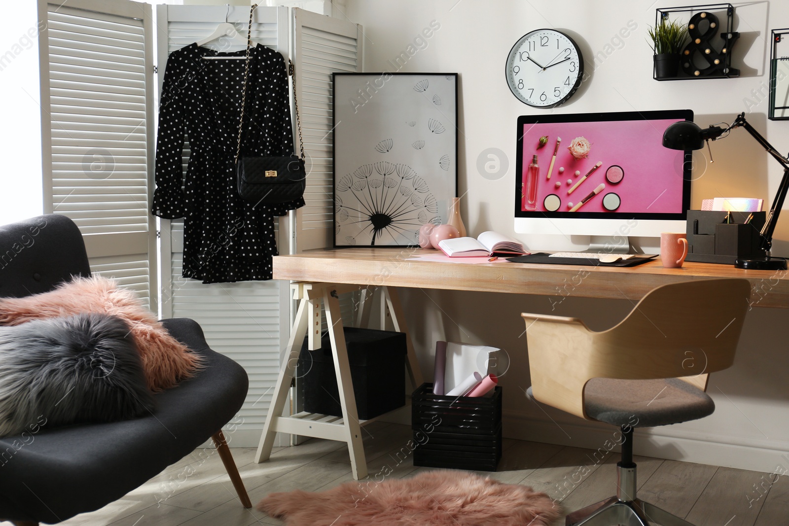 Photo of Modern workplace interior with computer on table