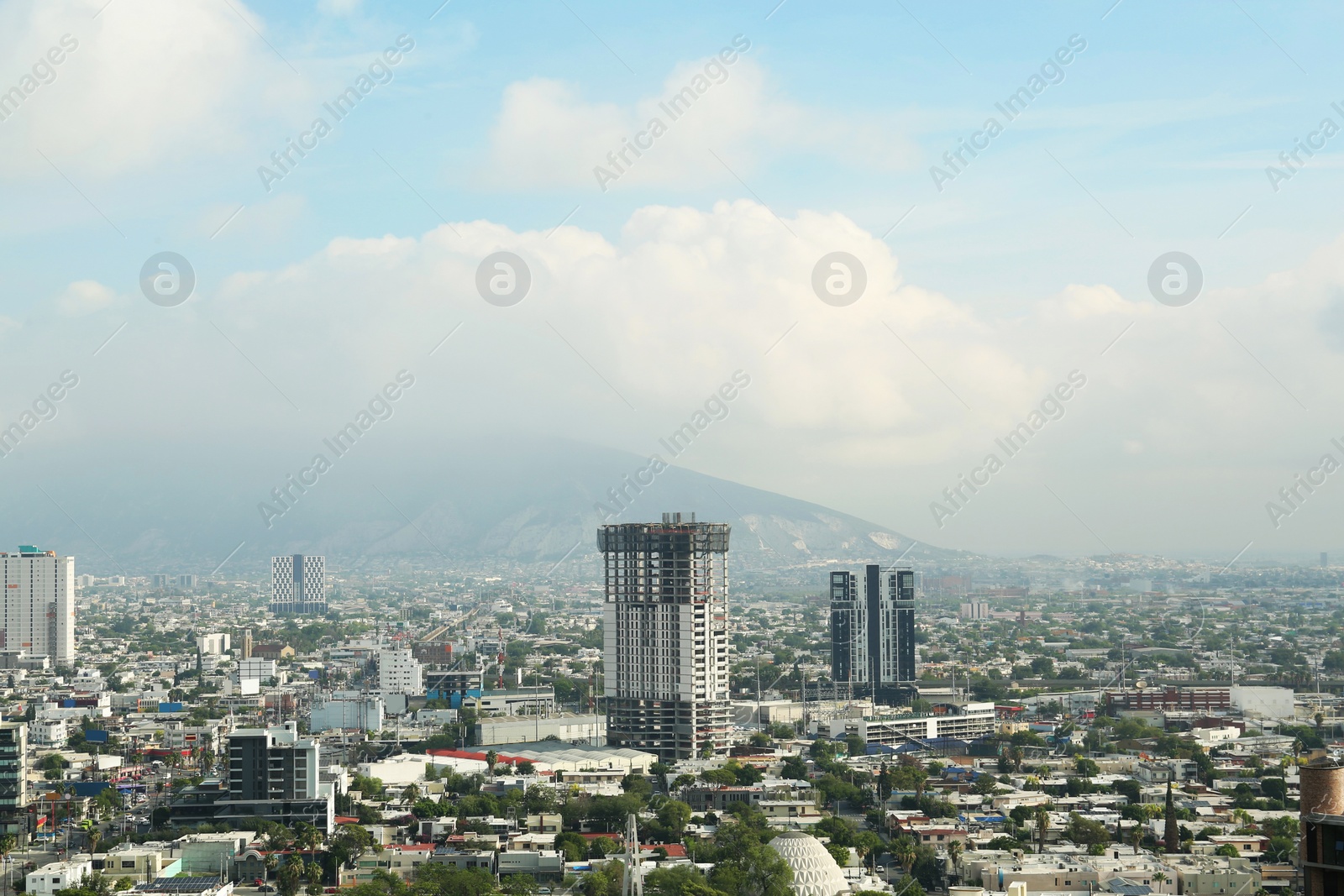 Photo of Picturesque view of beautiful cityscape under fog