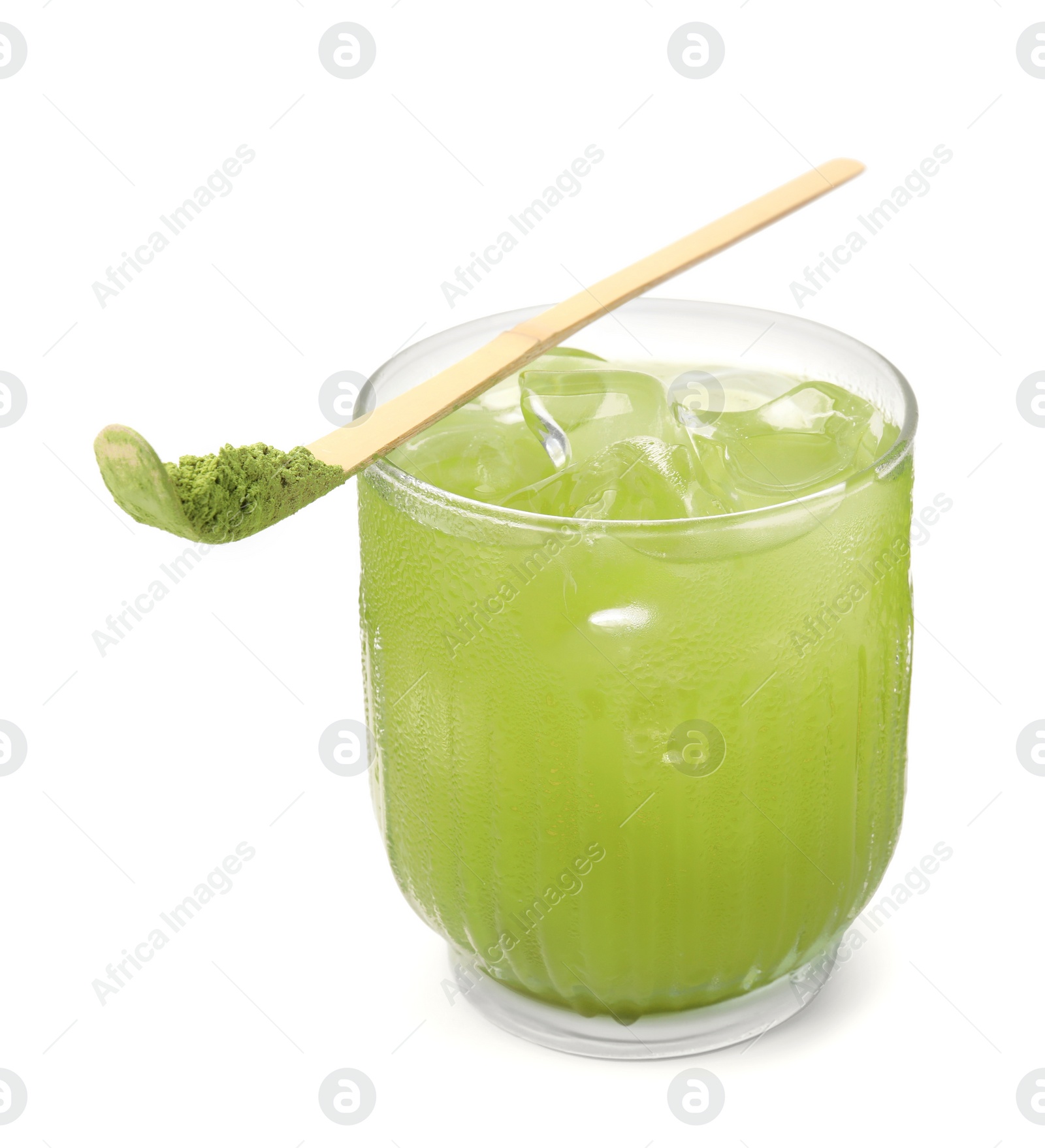 Photo of Glass of delicious iced green matcha tea and bamboo spoon with powder isolated on white