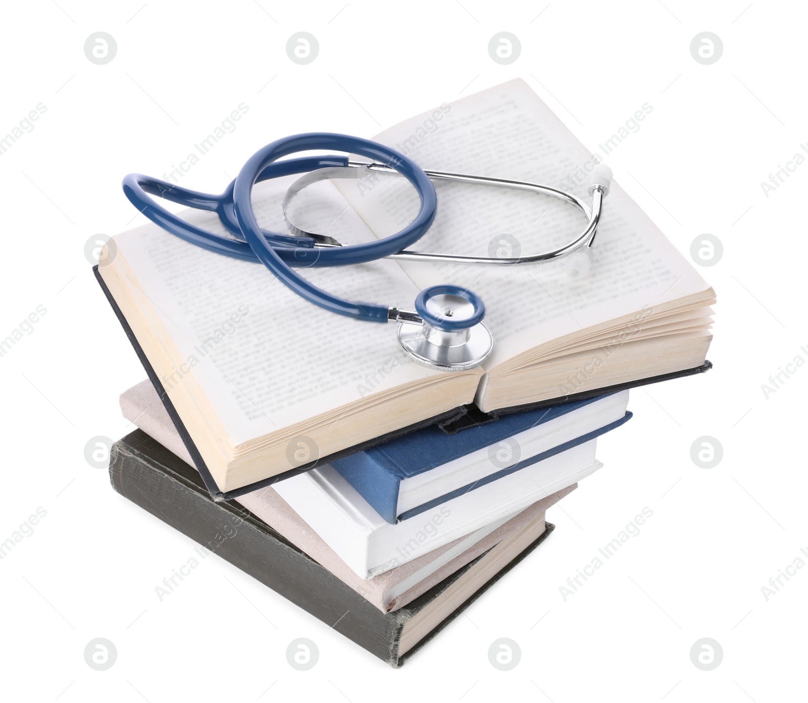 Photo of Stack of student textbooks and stethoscope on white background. Medical education