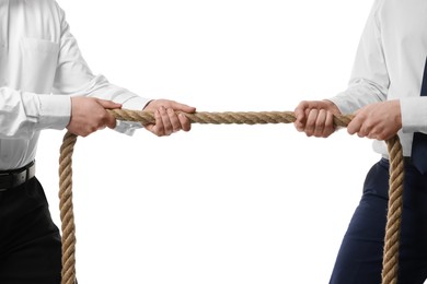 Dispute concept. Men pulling rope on white background, closeup