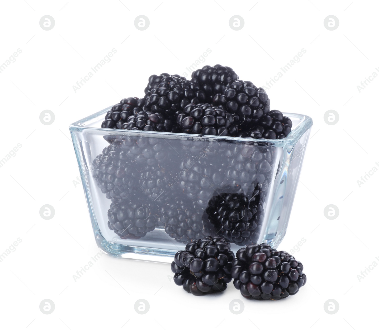 Photo of Glass bowl with blackberries on white background