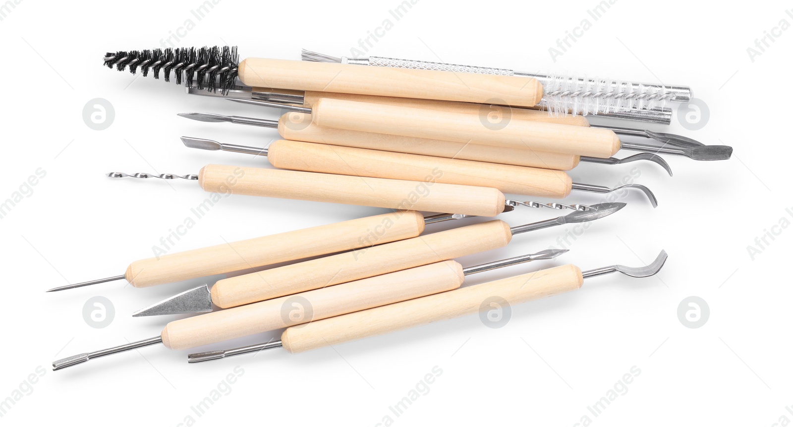 Photo of Set of different clay crafting tools isolated on white, top view