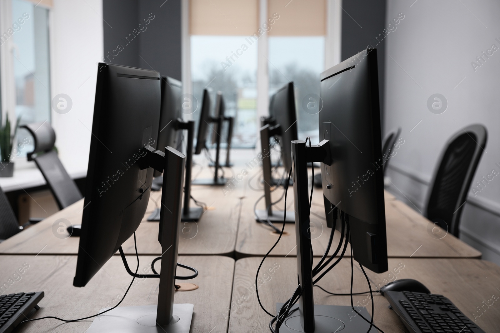 Photo of Many modern computers in open space office