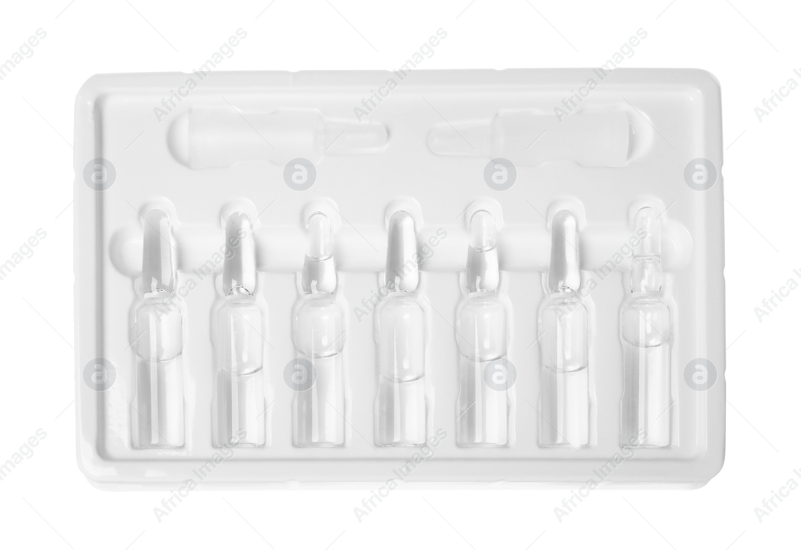 Photo of Glass ampoules with pharmaceutical product in tray on white background