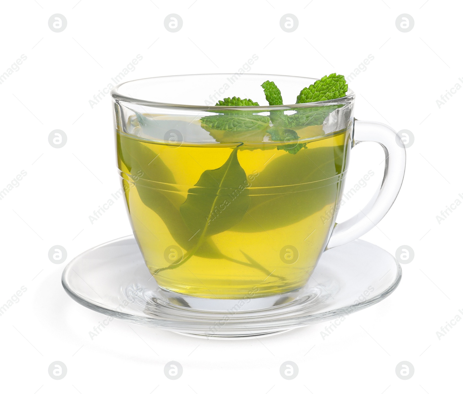 Photo of Fresh green tea in glass cup, mint and saucer isolated on white