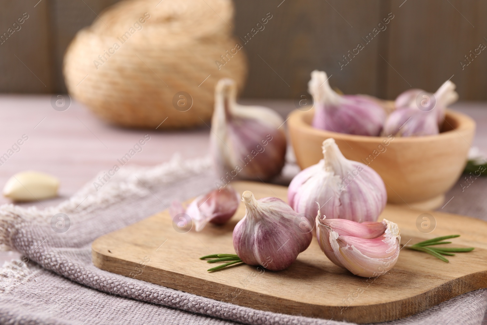 Photo of Bulbs and cloves of fresh garlic on table, closeup. Space for text