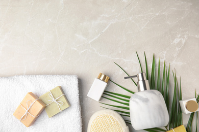 Flat lay composition with soap dispenser on marble background. Space for text