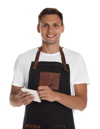 Portrait of happy young waiter with notebook on white background