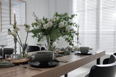 Festive table setting with beautiful tableware and decor indoors