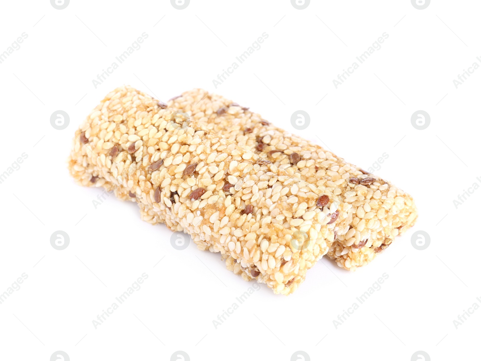 Photo of Tasty sesame seed bars isolated on white