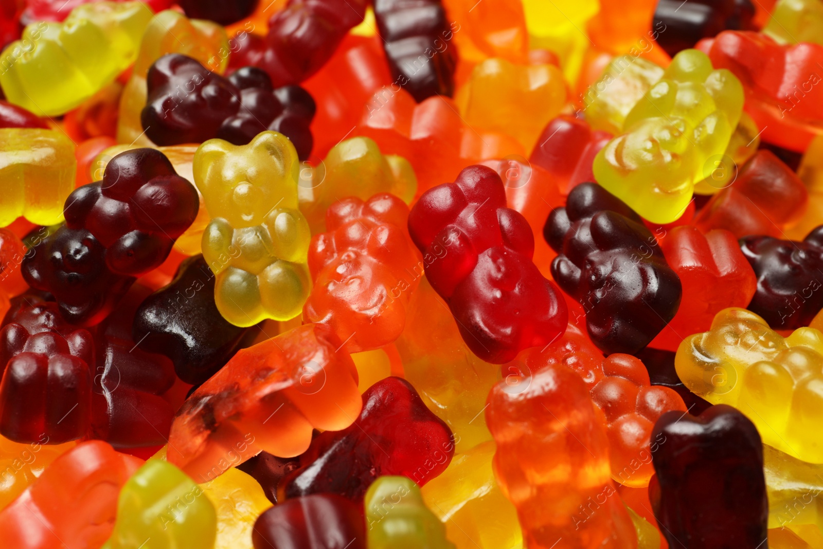 Photo of Delicious gummy bear candies as background, closeup