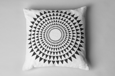 Soft decorative pillow on light background