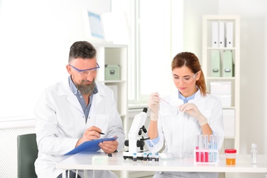 Scientists working in laboratory. Research and analysis