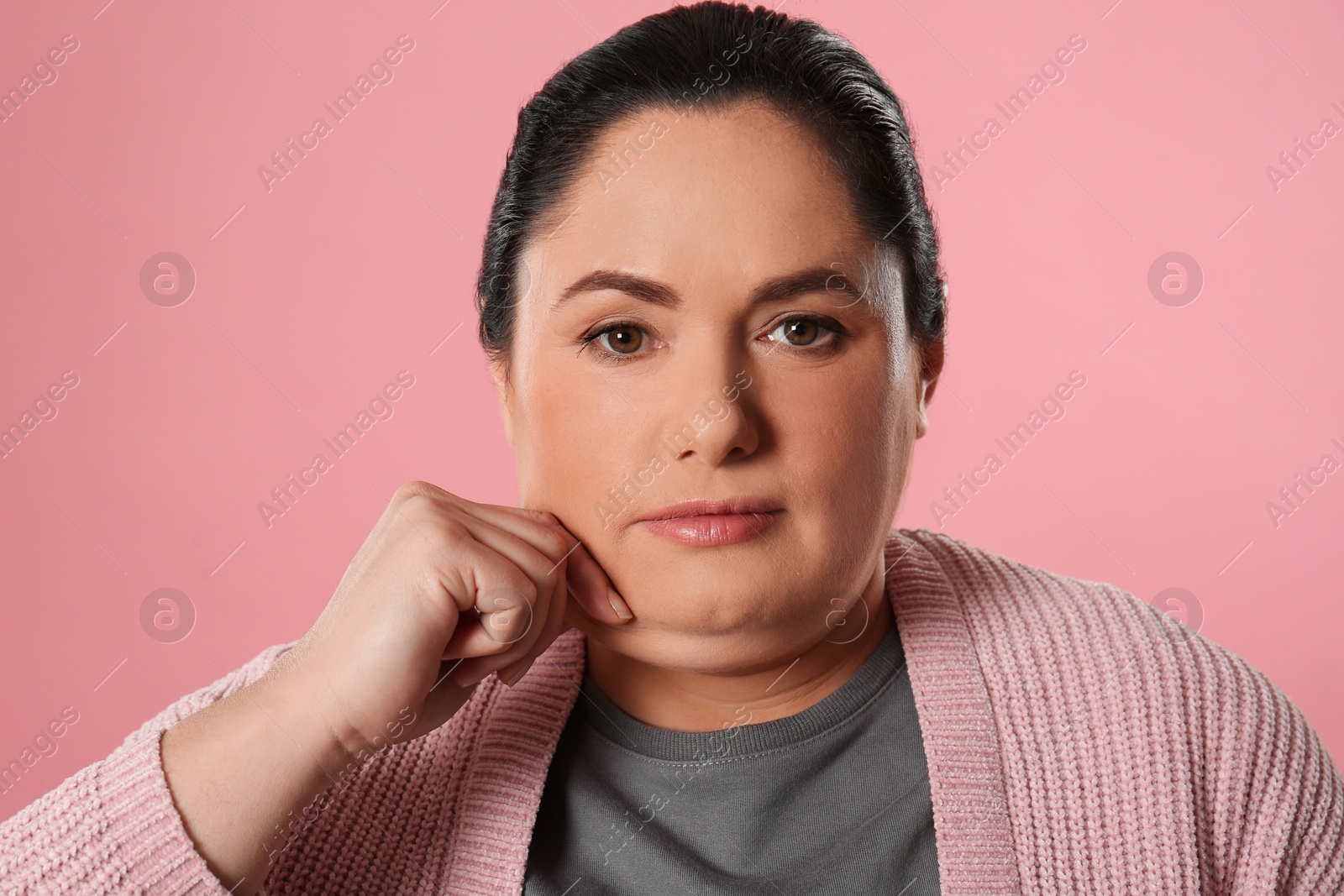 Photo of Woman with double chin on pink background