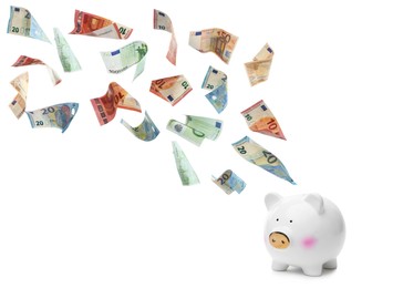 Image of Euro banknotes falling into piggy bank on white background