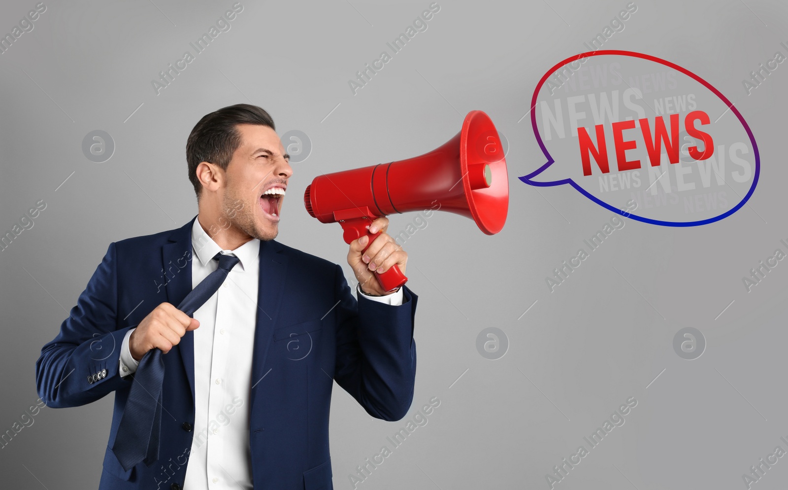 Image of Handsome man with megaphone on grey background