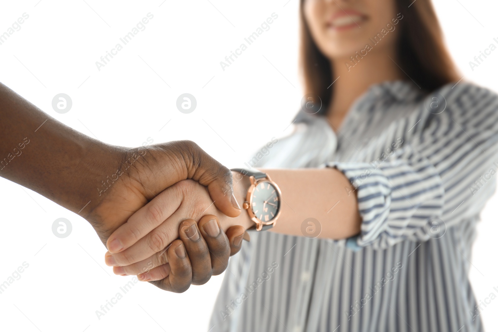 Photo of Man and woman shaking hands on light background, closeup. Unity concept