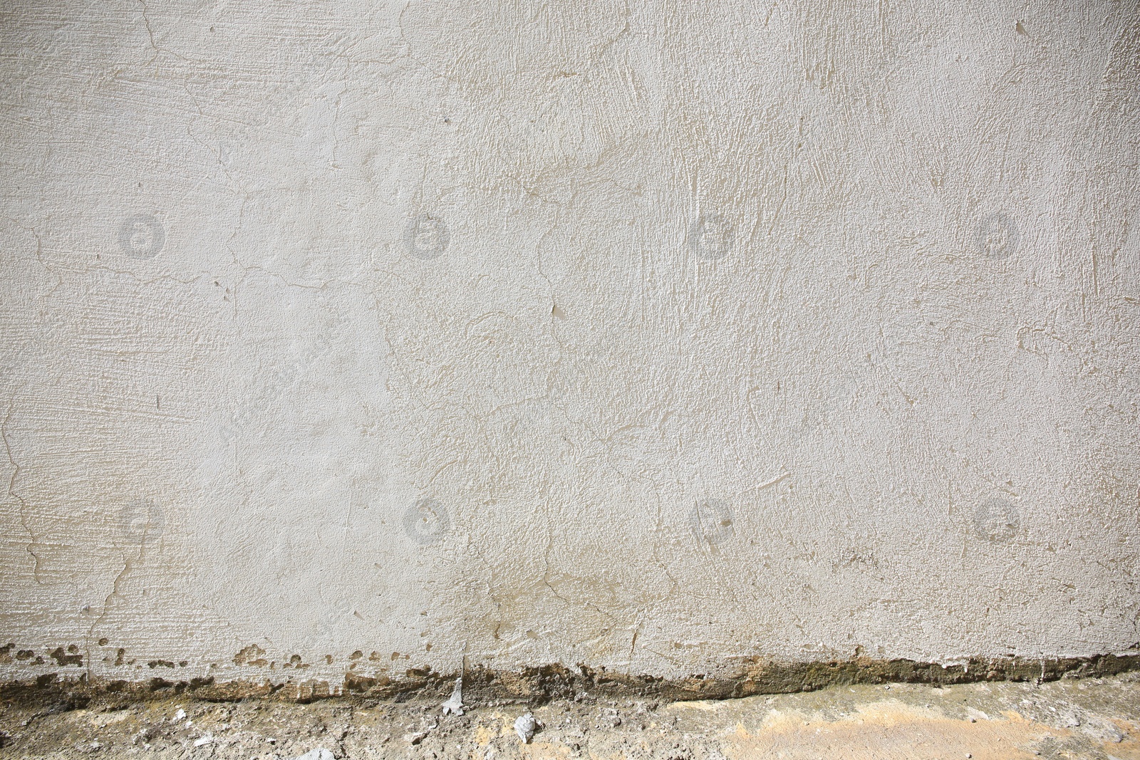 Photo of Beautiful old white wall and concrete sidewalk outdoors