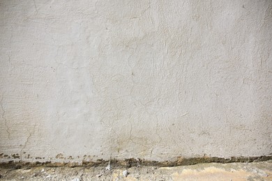 Photo of Beautiful old white wall and concrete sidewalk outdoors