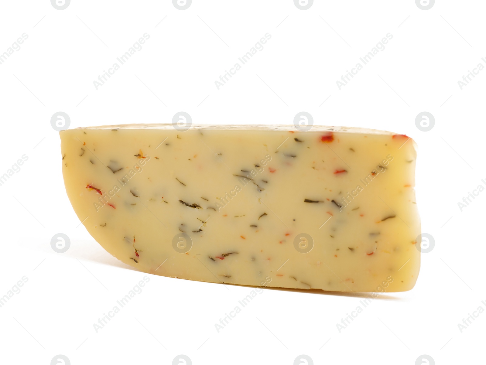 Photo of Piece of tasty cheese with basil and paprika isolated on white