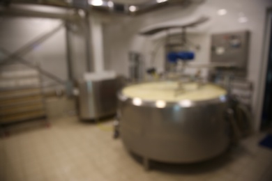 Blurred view of curd preparation tank at cheese factory